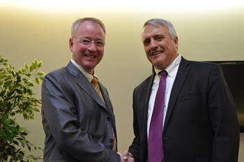 Dean Hughes shaking hands with Governor Ritter